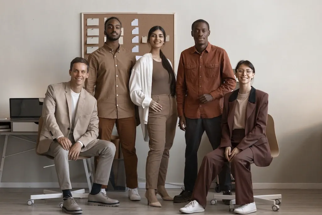 A diverse ethnicity of colleagues posing together