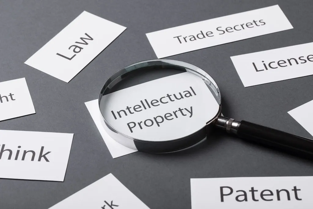 magnifying glass kept on top of intellectual property 