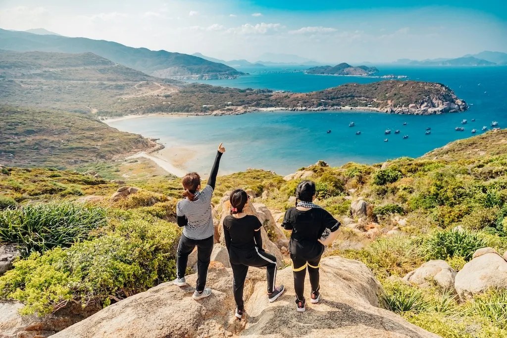 three girls enjoying the beach view