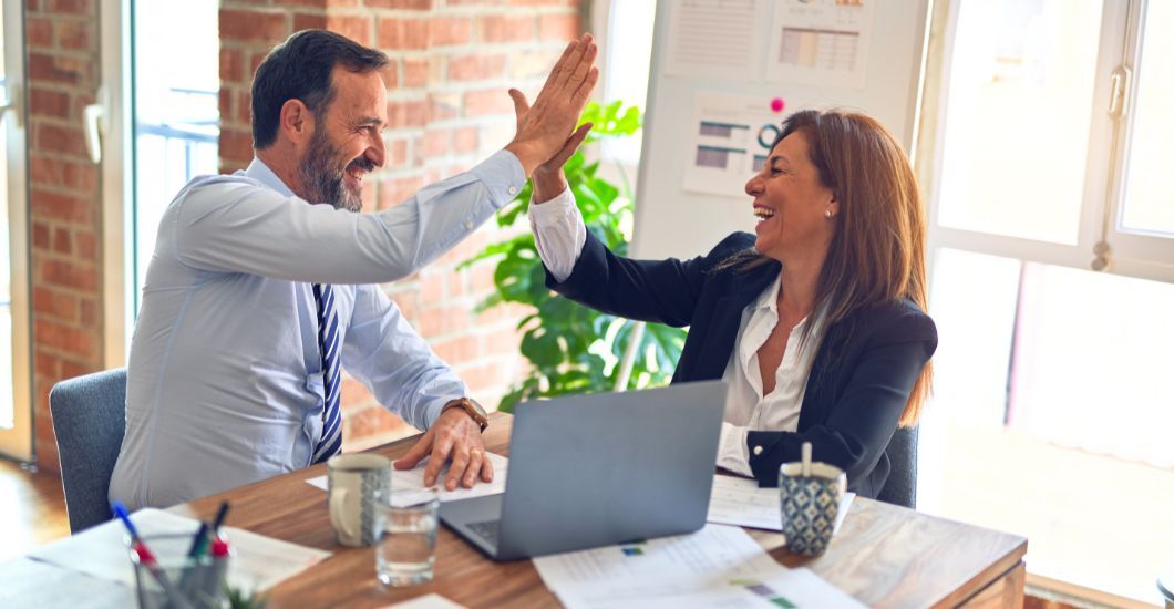 A man and a woman high fiving