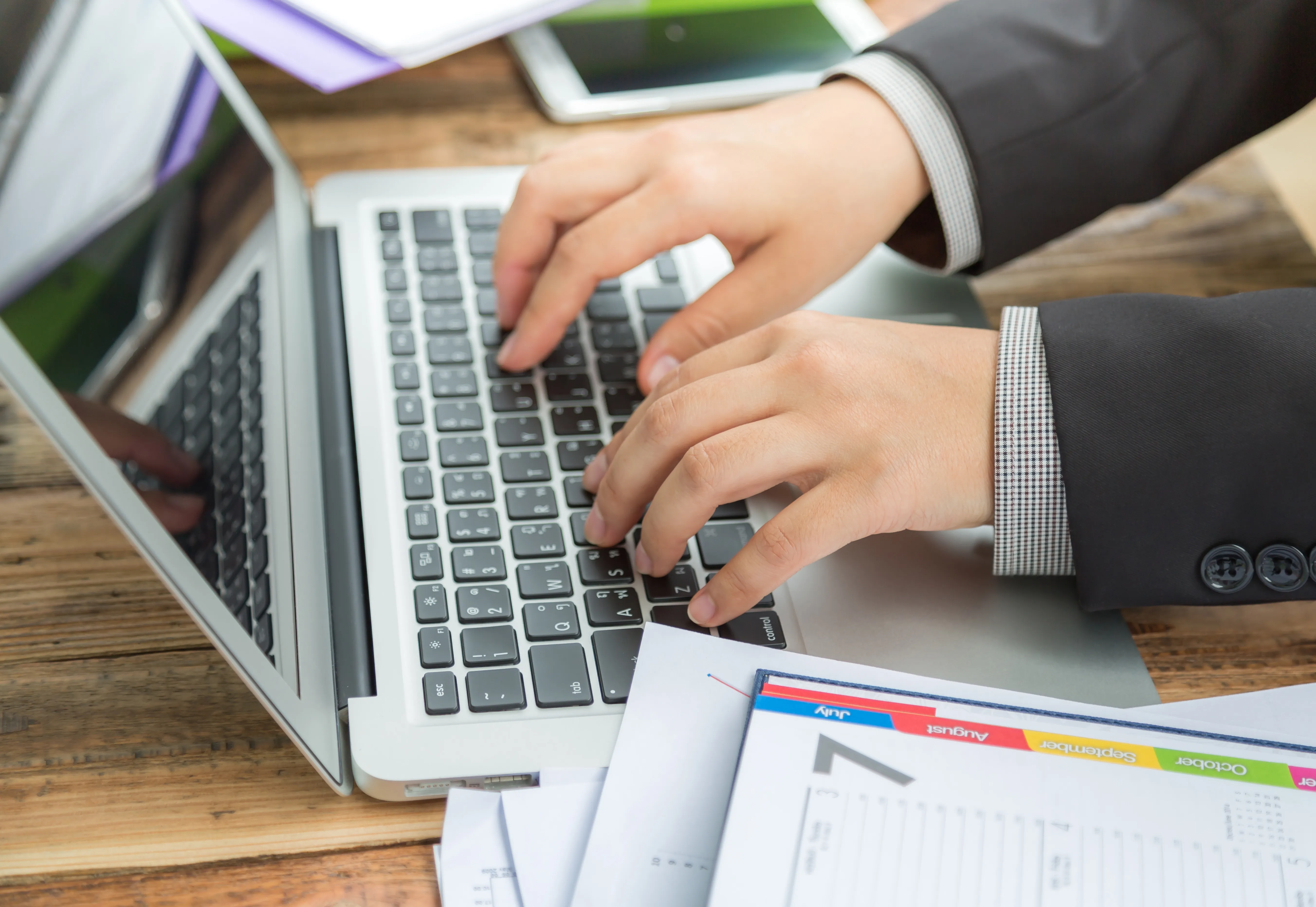 businessman-writing-laptop.webp