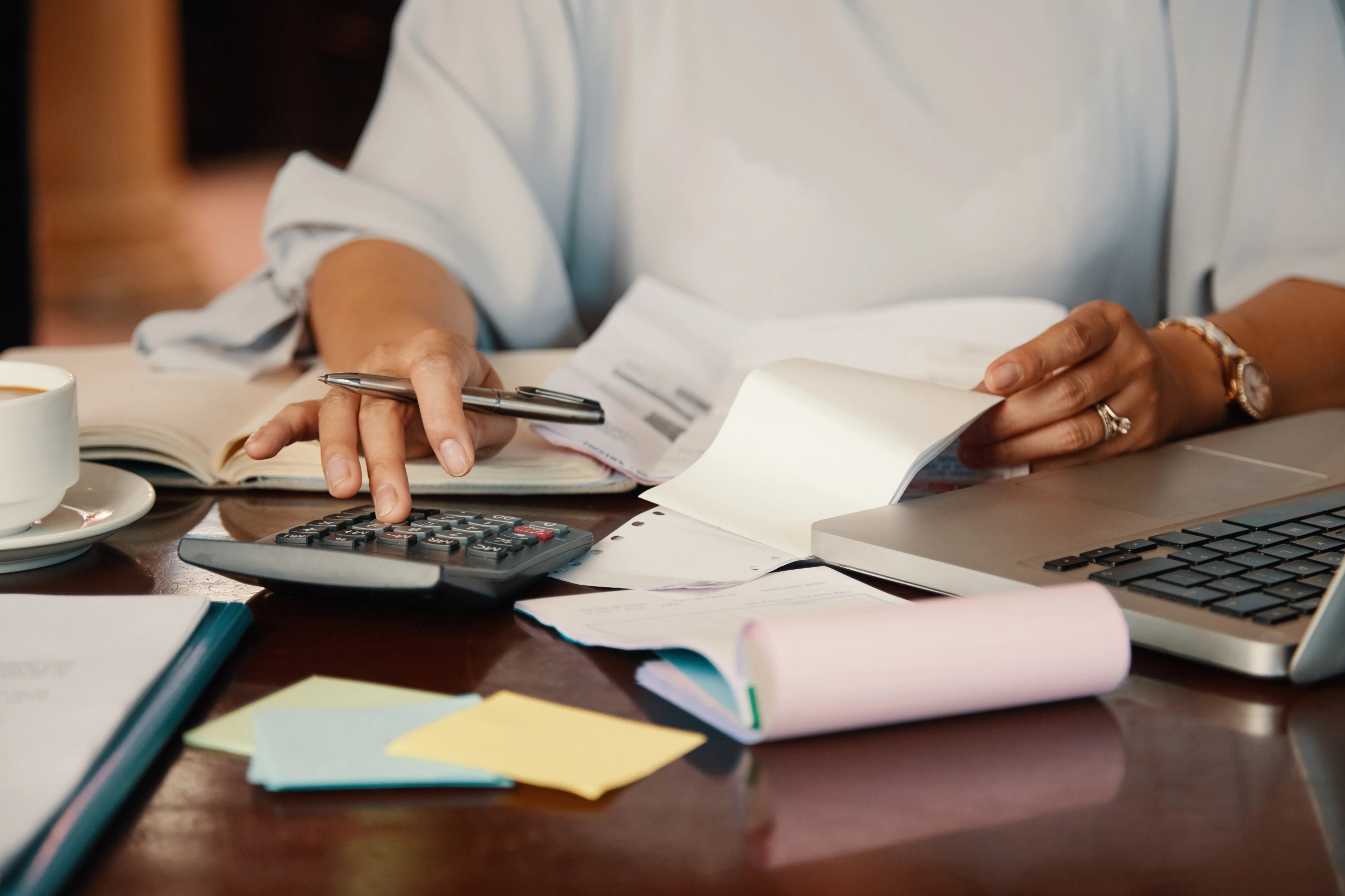 entrepreneur-working-with-bills.webp