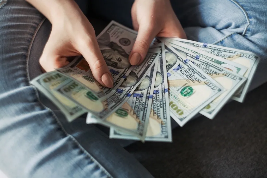 A person counting cash