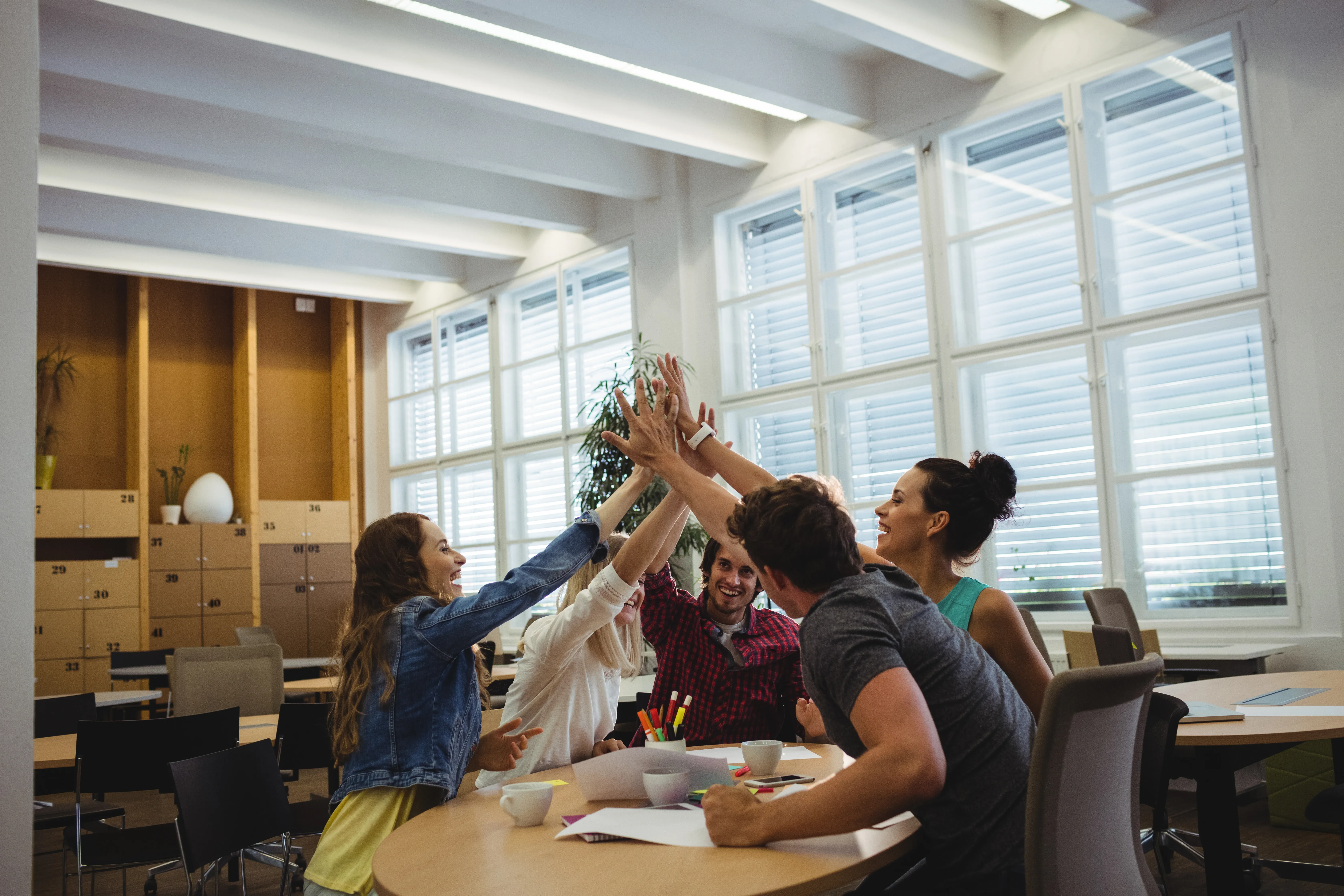 group-business-executives-giving-high-five.webp