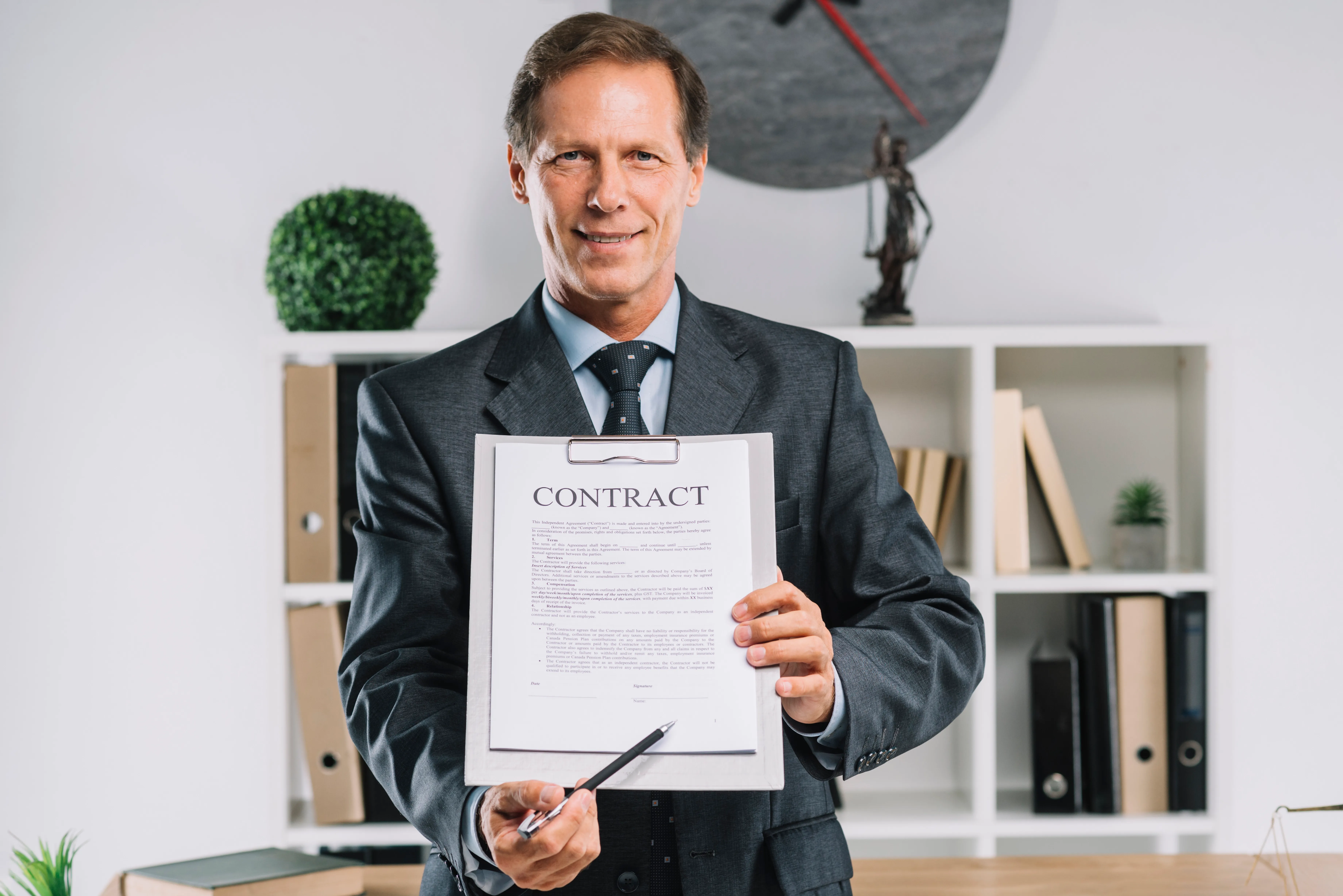 mature-lawyer-pointing-signature-place-contract-document-with-pen.webp
