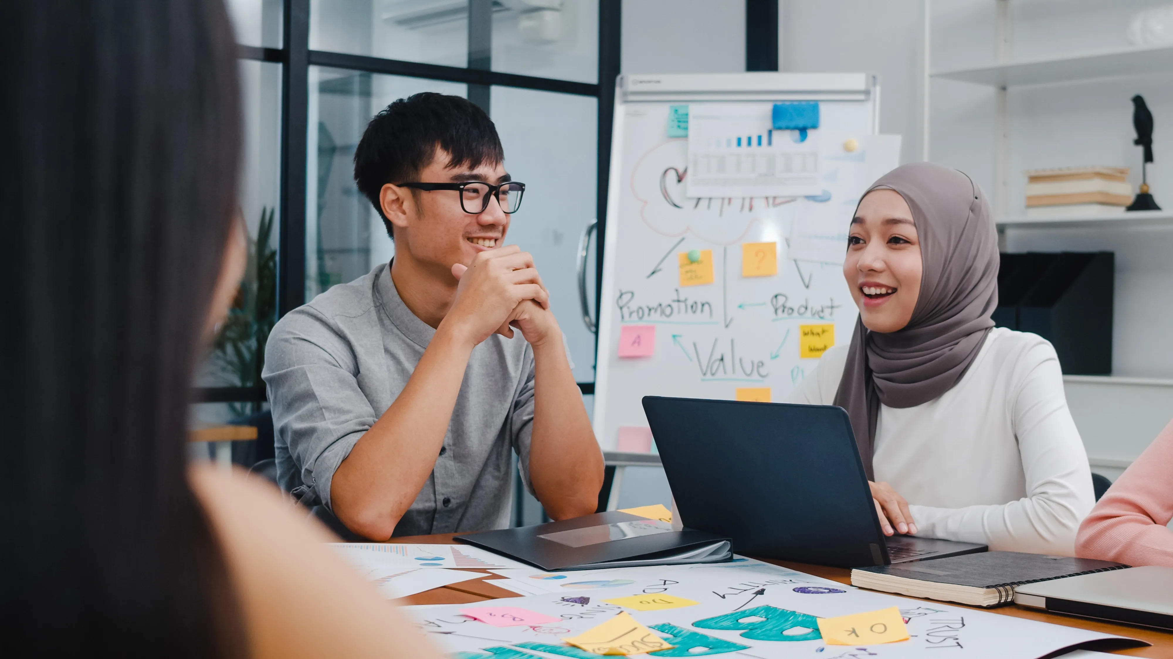 multiracial-group-young-creative-people-smart-casual-wear-discussing-business-brainstorming-meeting-ideas-mobile-application-software-design-project-modern-office.webp
