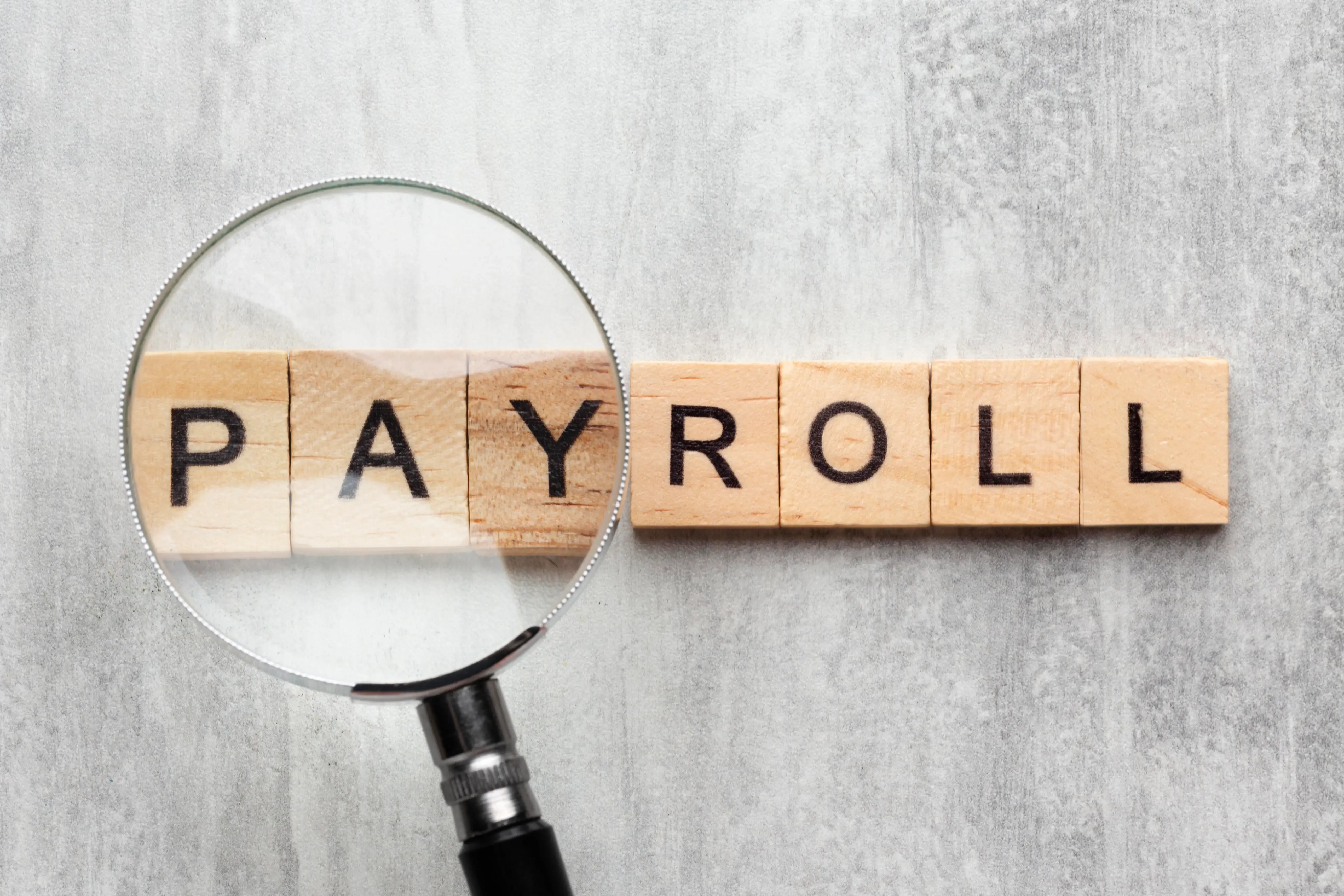 top-view-payroll-concept-with-wooden-cubes.webp